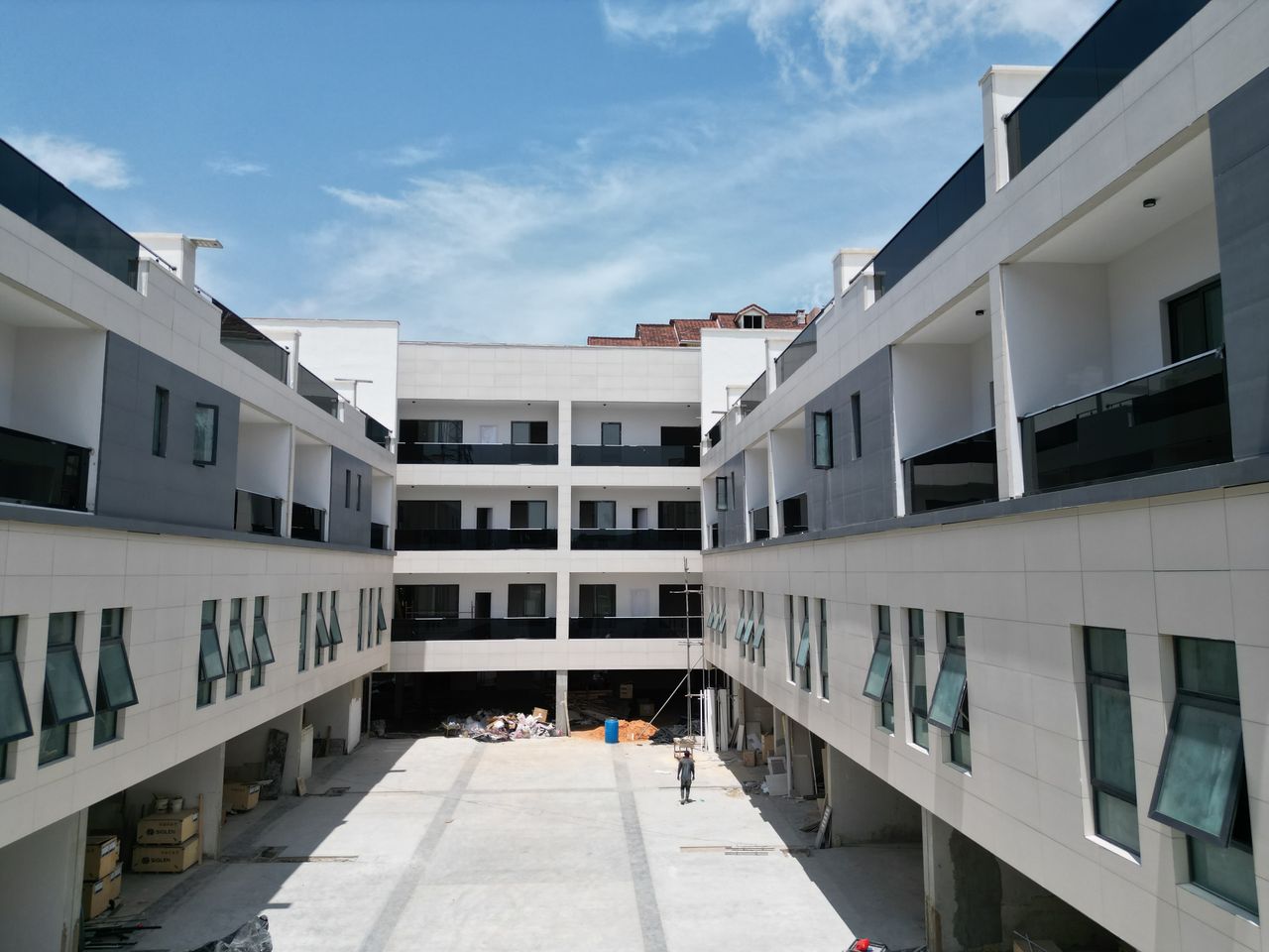 Crafting Captivating Headlines: Your awesome post title goes here Daytime view of a modern apartment complex under construction, showcasing sleek design and architecture in Lagos, Nigeria.